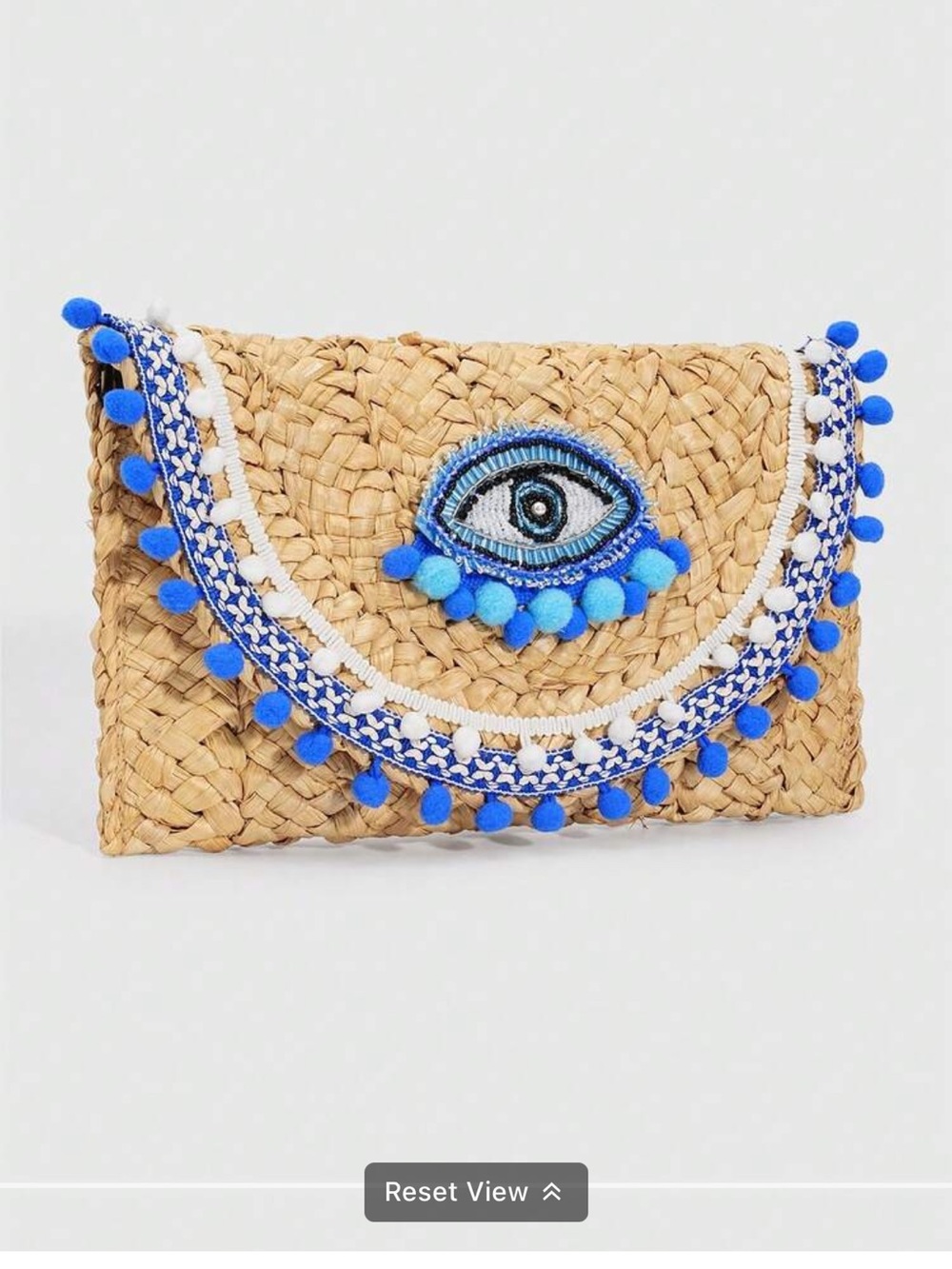 Woven Straw Clutch with Blue Pom-Pom Eye Accent